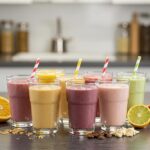 Colorful weight loss shakes with fruits and vegetables in a bright kitchen setting