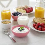 Healthy breakfast spread with Greek yogurt, berries, and whole grain toast