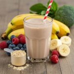 Delicious protein shake with fresh fruits and protein powder, representing health and fitness