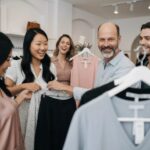 Diverse individuals exploring fashion choices that suit their body types in a boutique setting