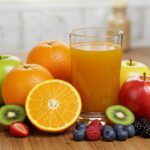 Fresh fruits and a glass of juice representing healthy homemade fruit juice